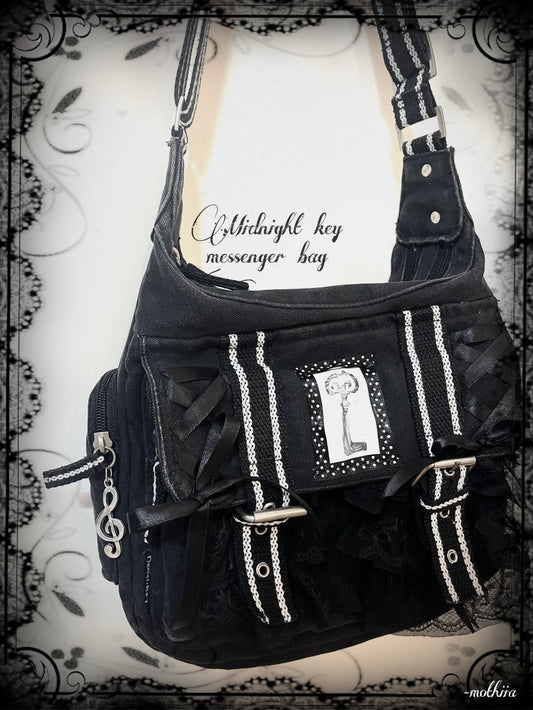 “Midnight key” messenger bag